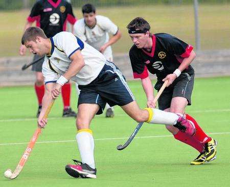 Maidstone hockey player Jon Cooper in action against Ashford