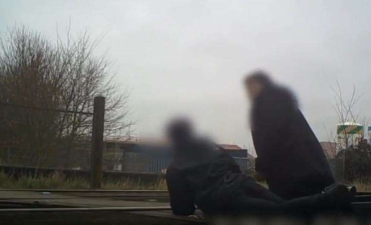 Youngsters lying on the tracks at the crossing in 2017. Picture: Network Rail