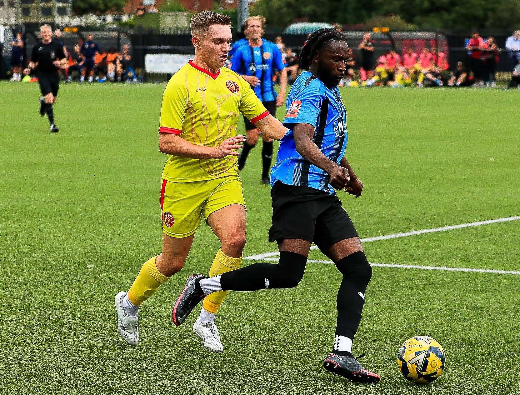 Whitstable’s Josh Oliver tracks Sevenoaks’ Salim Futa during Saturday’s FA Cup tie. Picture: Les Biggs