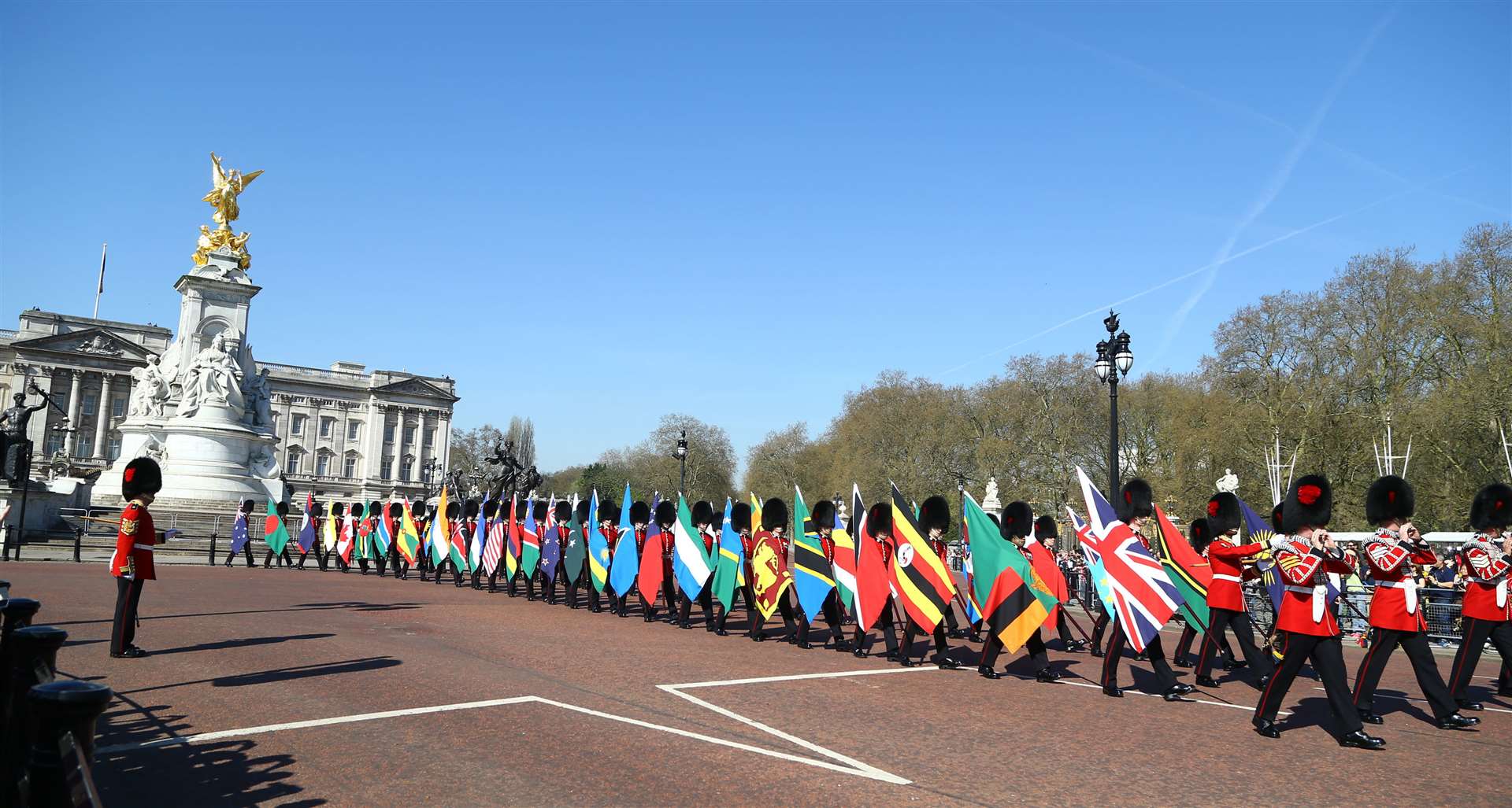 Soldiers of the Coldstream Guards carry flags of the Commonwealth countries along The Mall during the 2018 CHOGM (Gareth Fuller/PA)