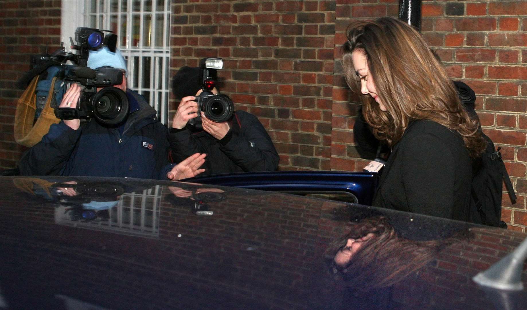 Kate Middleton is met by photographers and film crews outside her house in London on her 25th birthday (Lewis Whyld/PA)