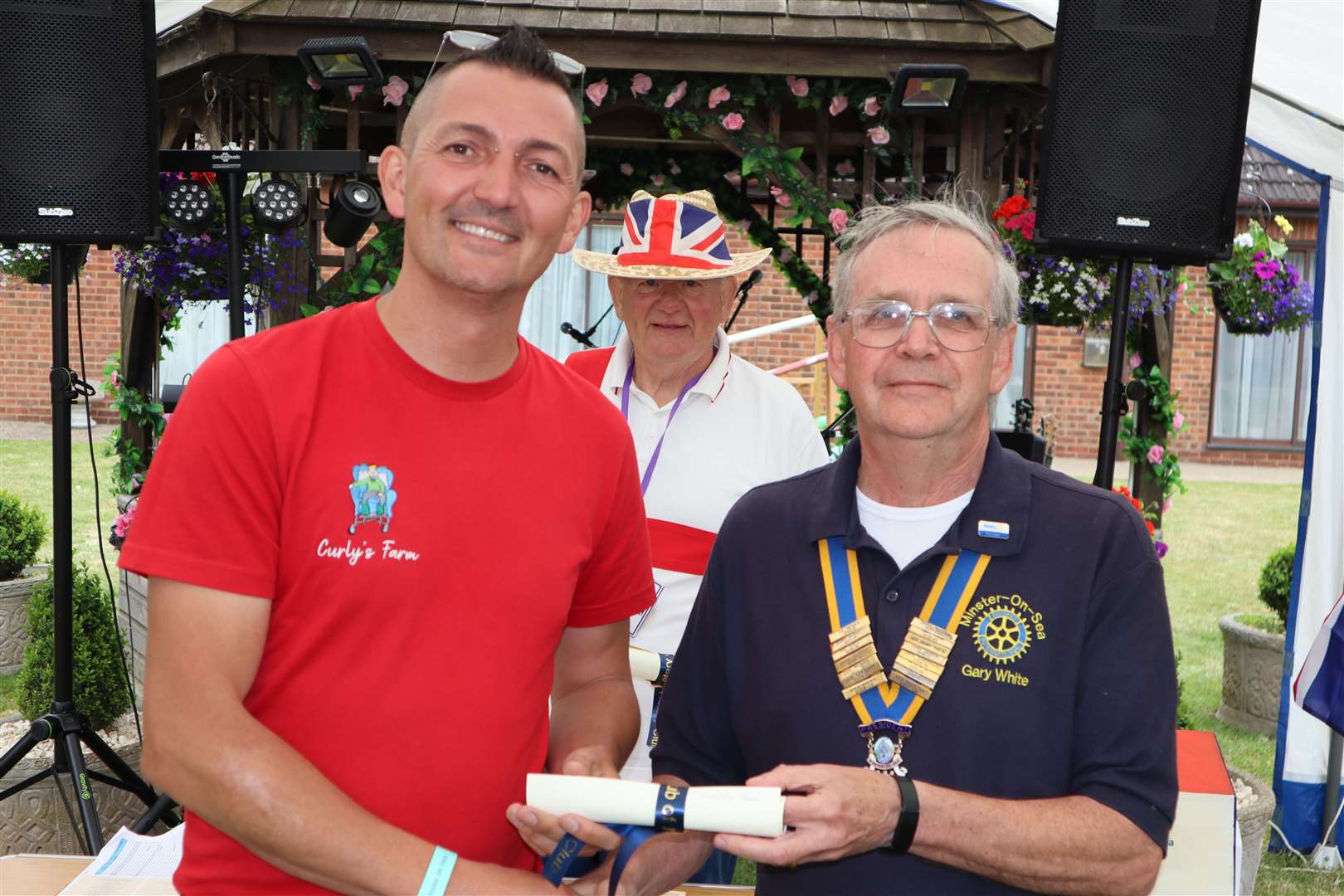 Kyle Ratcliffe of Curly's Farm with president Gary White at Minster-on-Sea Rotary Club's Platinum Jubilee volunteer awards at the Abbey Hotel