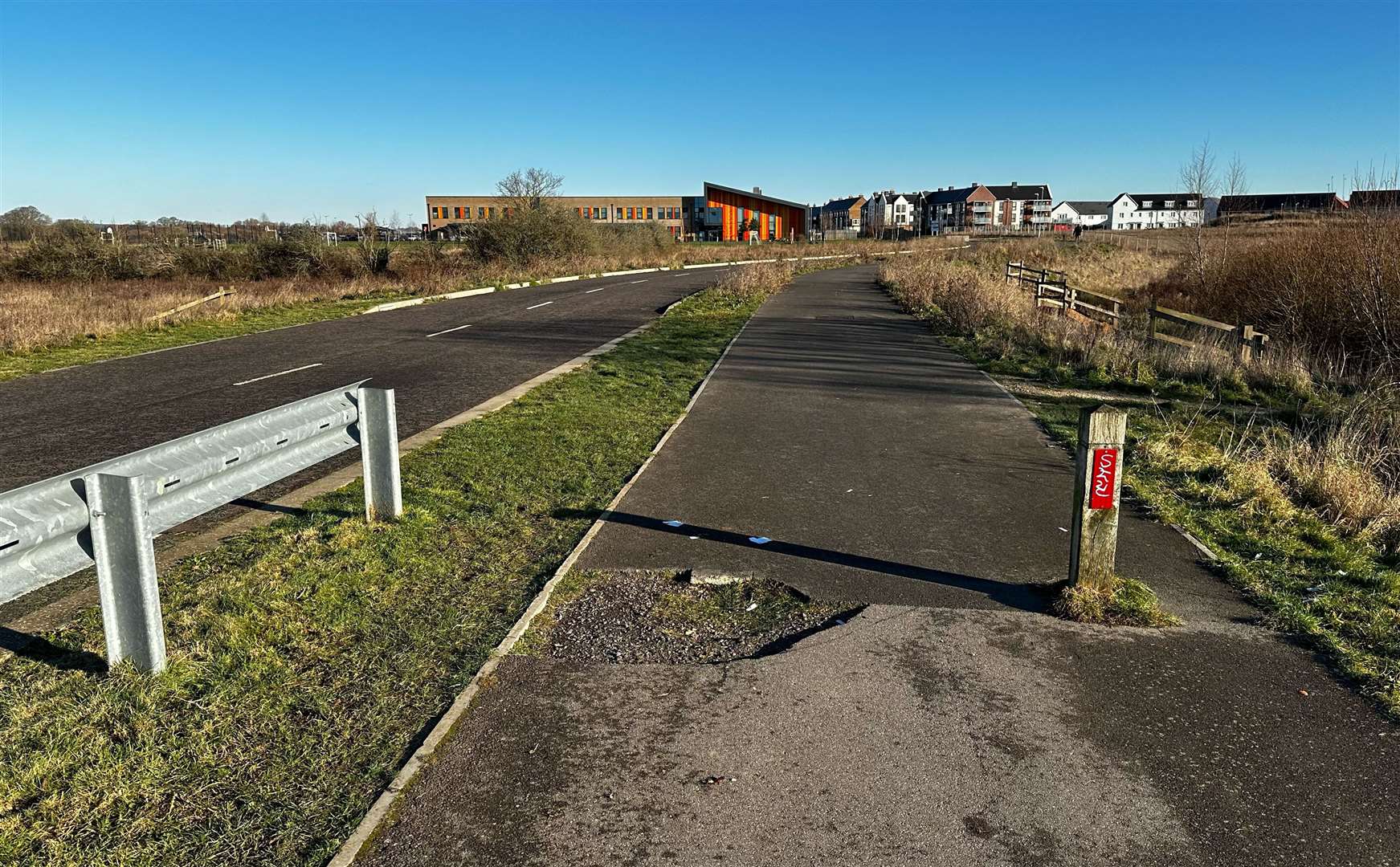 Broken bollards mean cars can squeeze through the gap onto the path which runs along the closed stretch of Avocet Way between Finberry and Bridgefield in Ashford