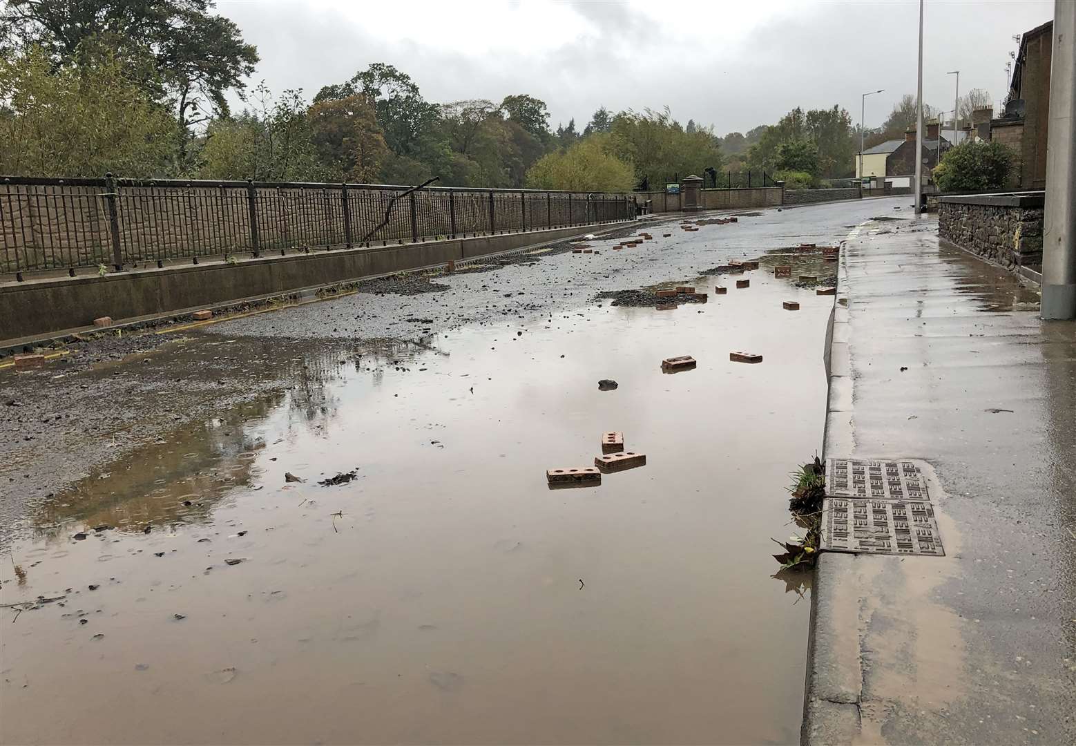 The street was left strewn with debris on Saturday morning (Neil Pooran/PA)