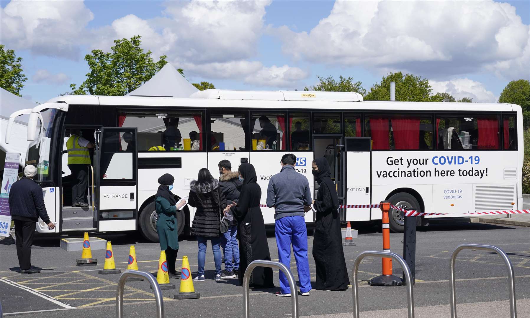 People queuing for Covid-19 vaccinations at the Essa Academy in Bolton (Danny Lawson/PA)