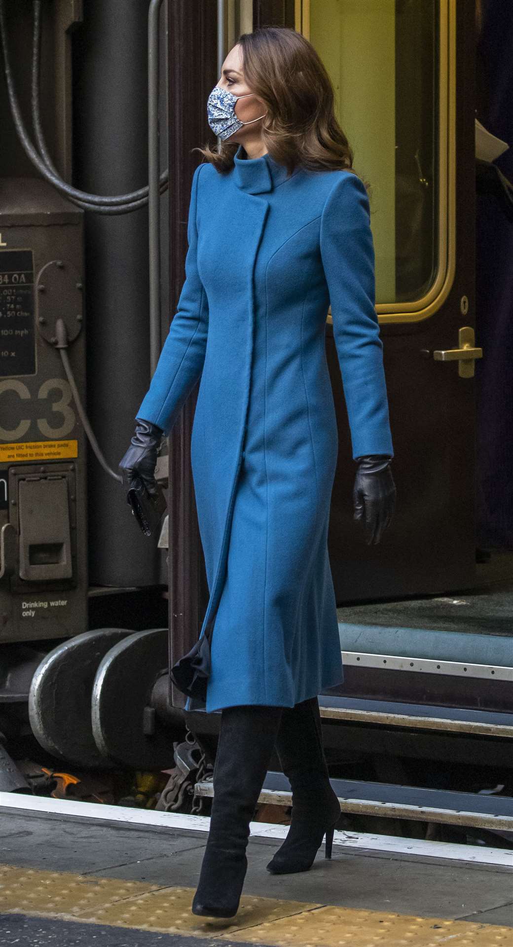 The Duchess of Cambridge wore a long coat for the trip (Andy Barr/PA)