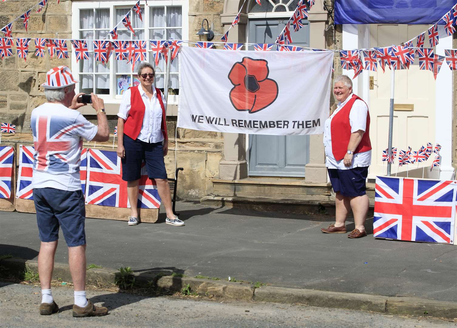 Residents in Thorner, West Yorkshire pay tribute to the fallen (Danny Lawson/PA)