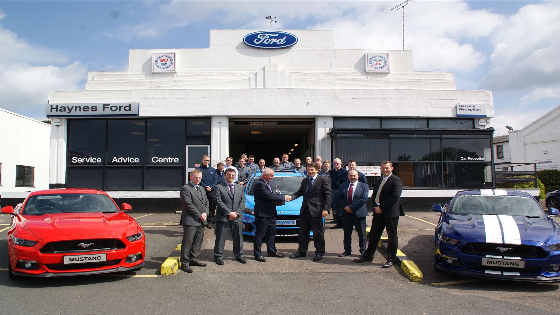 Steve Clary, left, presents the Ford Motor Company's Chairman's Award to Haynes chairman and managing director Andrew Haynes