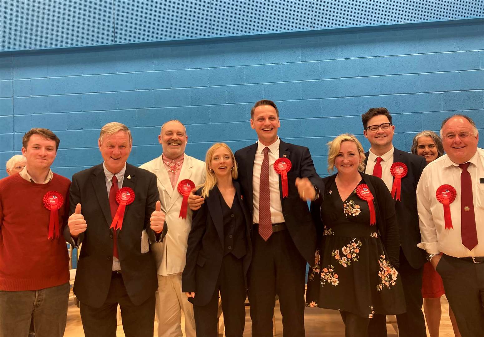 Labour's Mike Tapp (centre) and his campaign team celebrating their victory