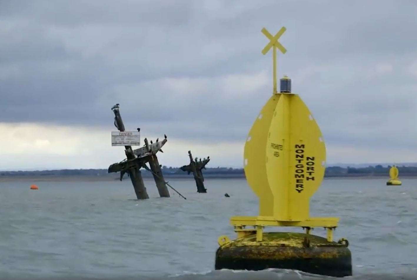 The masts of the Sheppey bomb ship the SS Richard Montgomery and danger buoy Picture: NDR