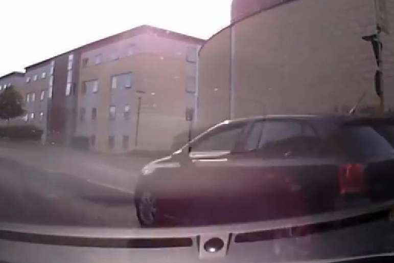 A driver overtakes Philip Hunt on a mini roundabout at the University of Kent campus