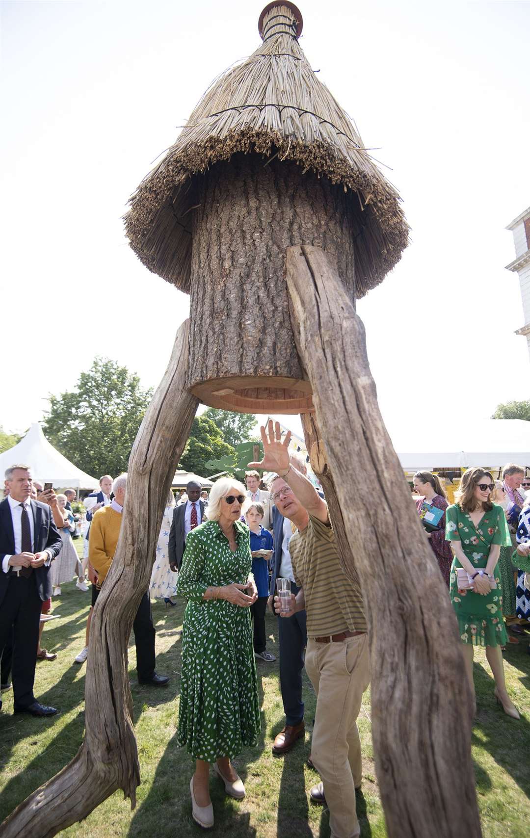 Camilla looks at a rocket hive with celebrity chef Hugh Fearnley-Whittingstall (Eddie Mulholland/Daily Telegraph/PA)