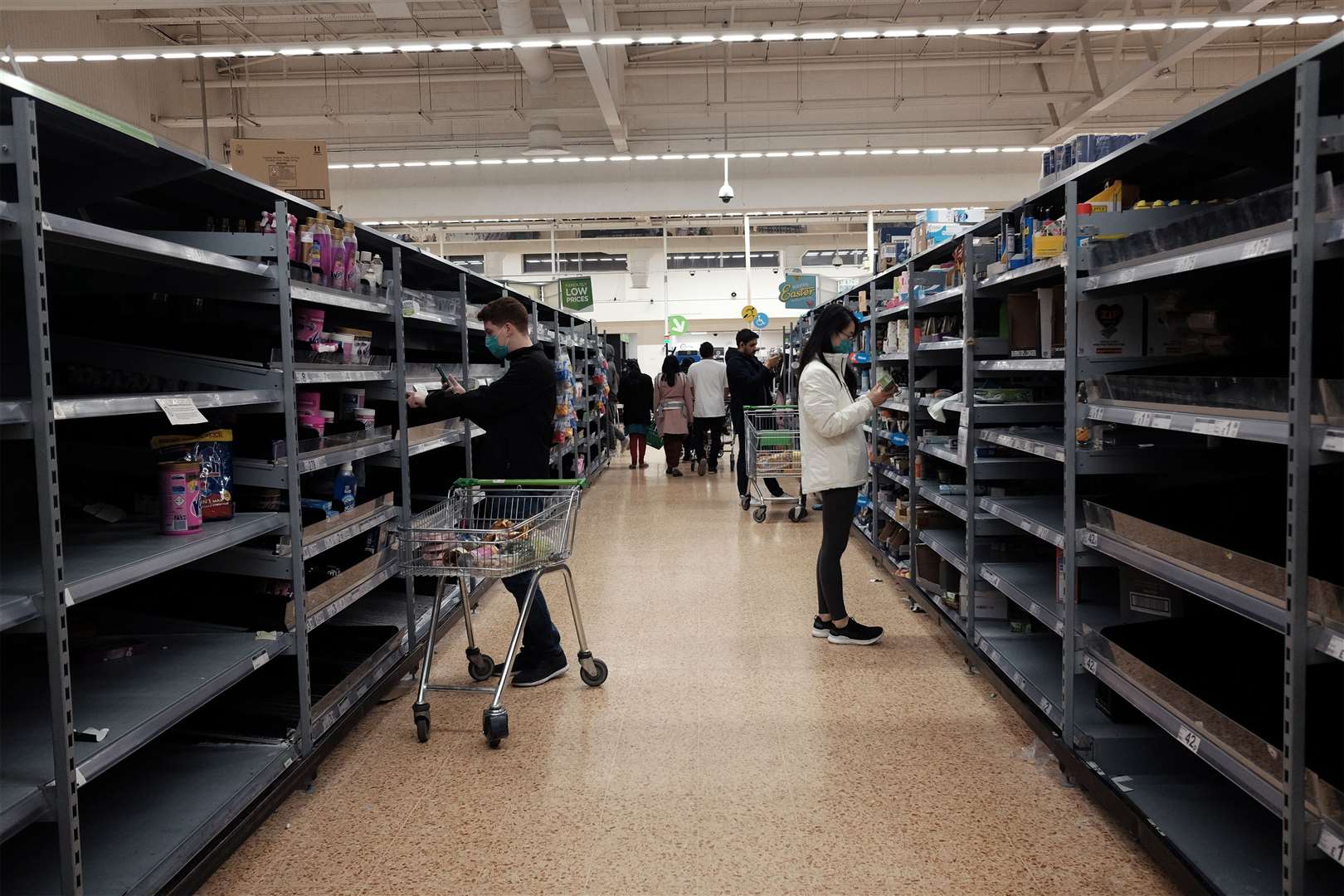 Prior to lockdown, entire shelves were cleared as shoppers stocked up (Yui Mok / PA)