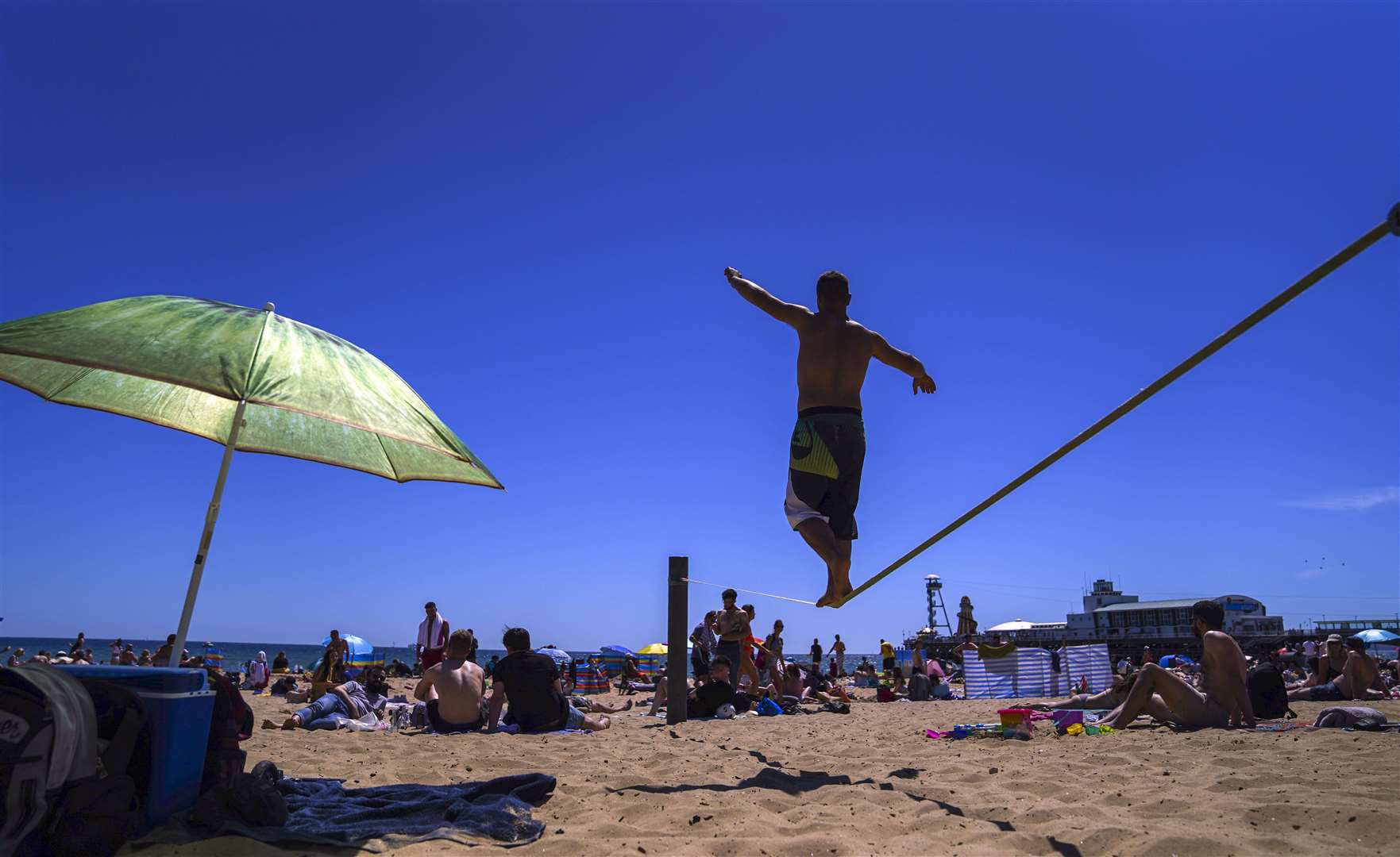 People enjoy the weather on Bournemouth beach in Dorset (Steve Parsons/PA)