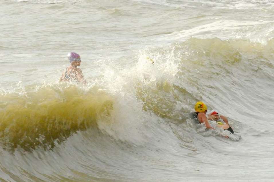 Swimmers take advantage of the high tides at Folkestone