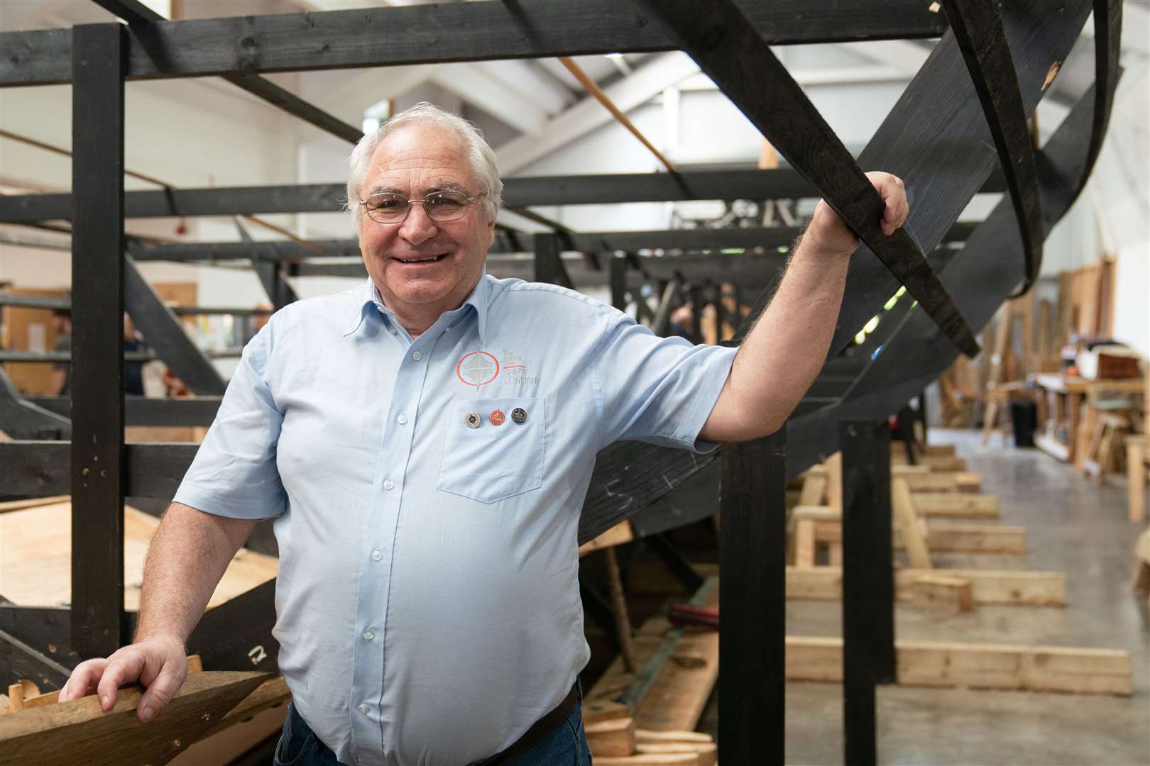 Master shipbuilder Tim Kirk with the replica of the Sutton Hoo longship (Joe Giddens/PA)