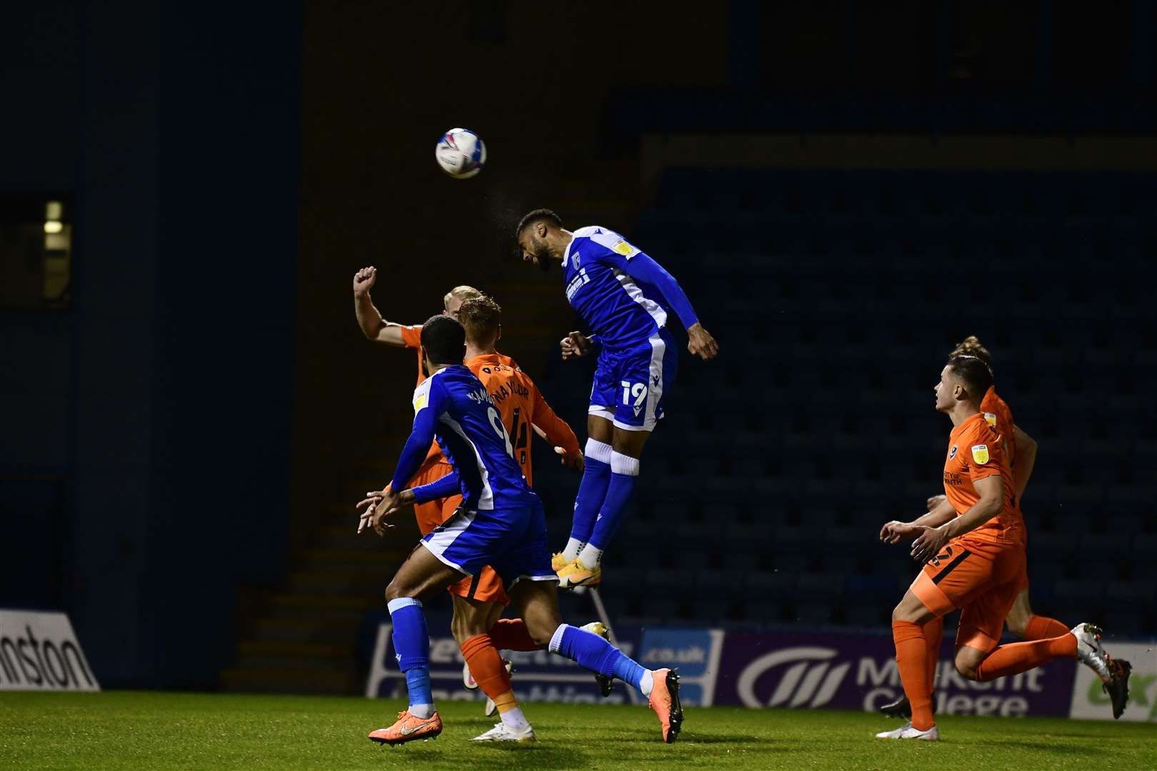 Gillingham striker Vadaine Oliver wins a header Picture: Barry Goodwin