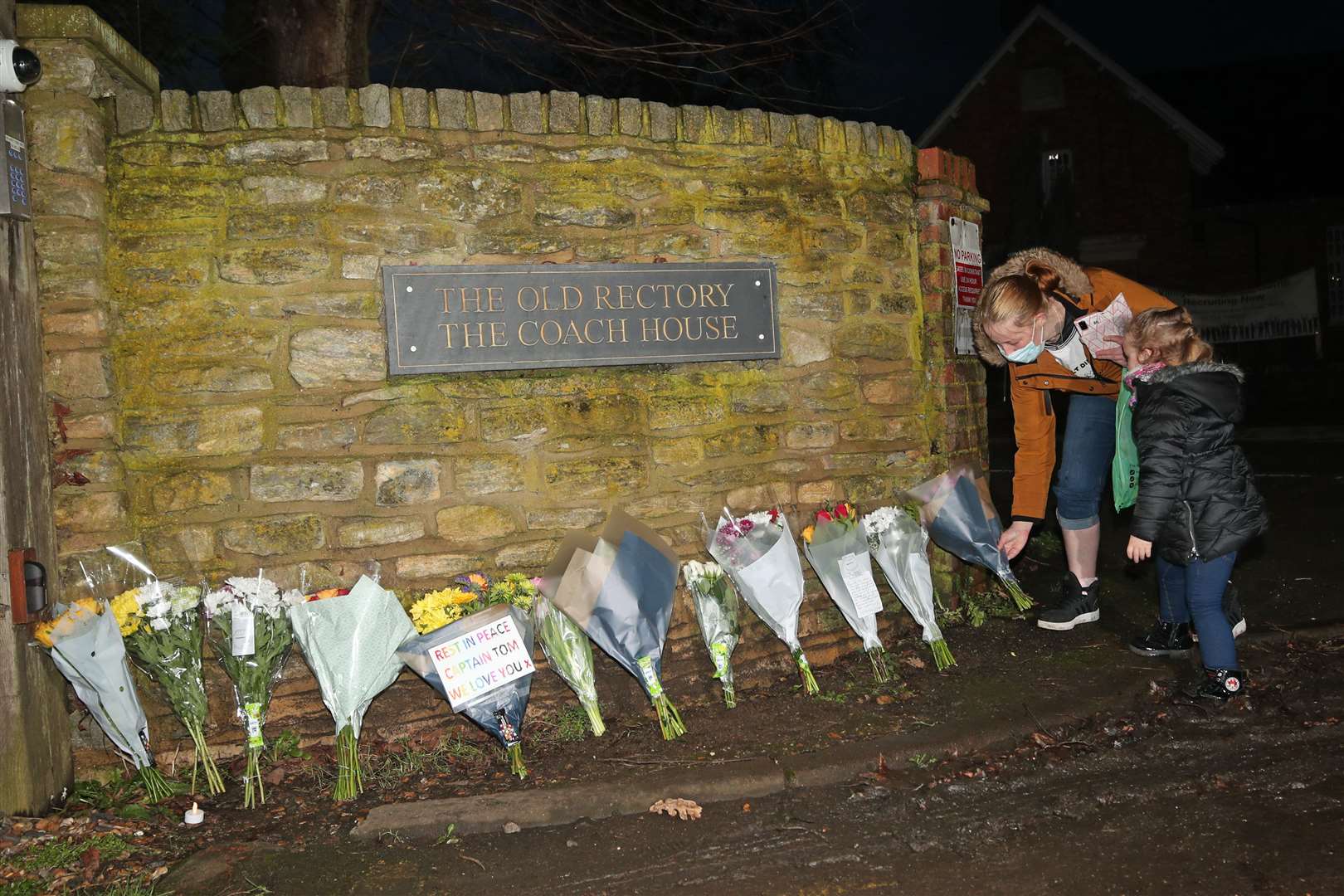 Floral tributes left outside the home of Sir Tom (Yui Mok/PA)