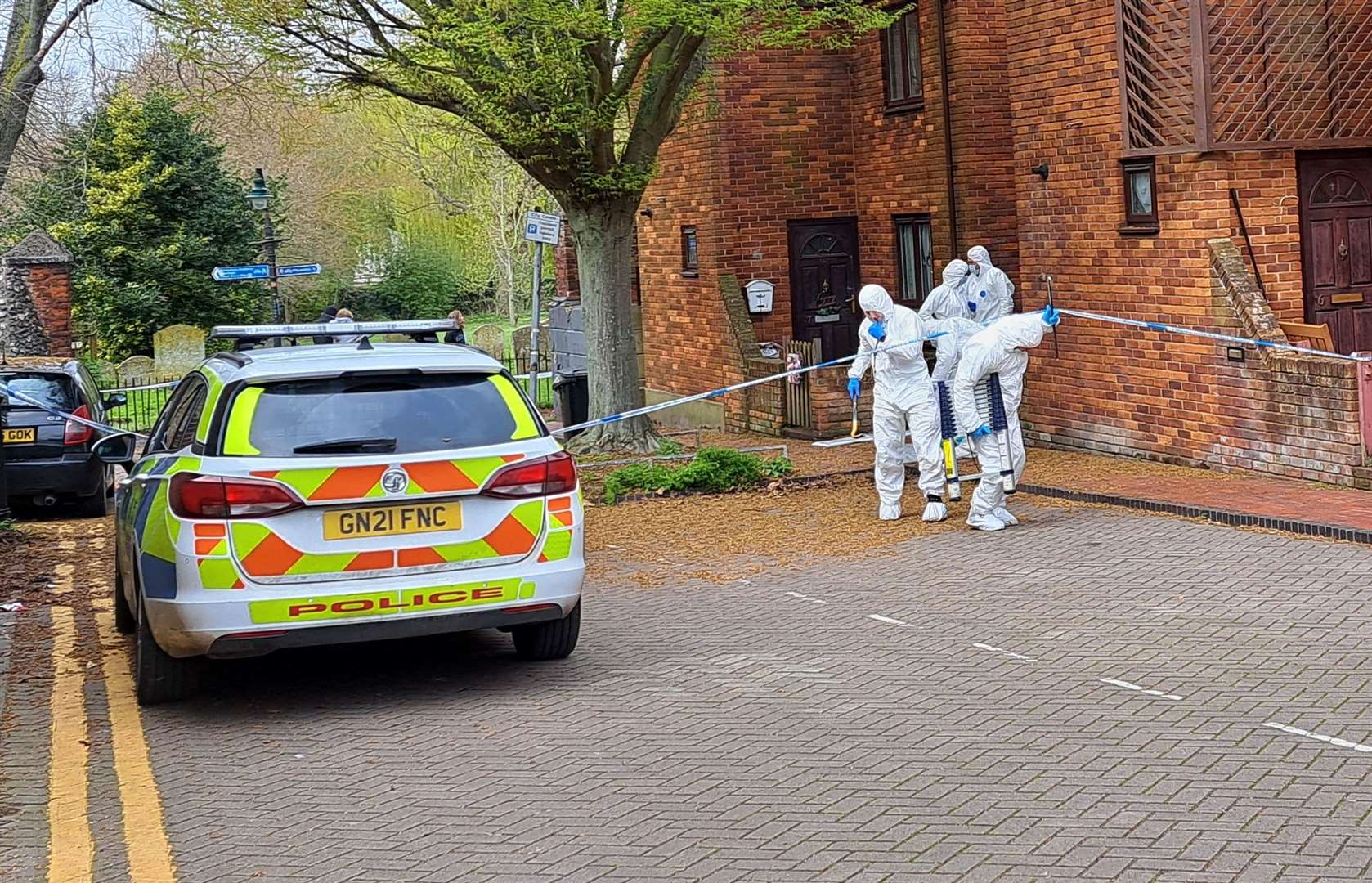 Police and forensics investigate a suspected murder after a man was found dead near Castle Street car park in Canterbury