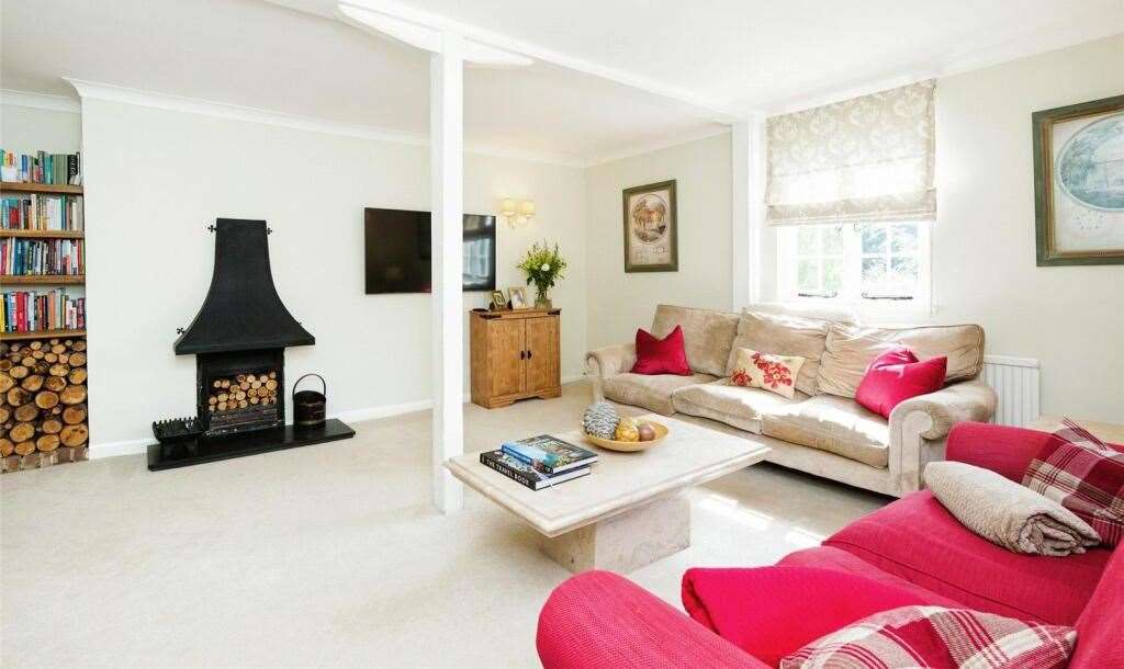 Relax in front of the wood burning stove in the living room. Picture: Freeman Forman