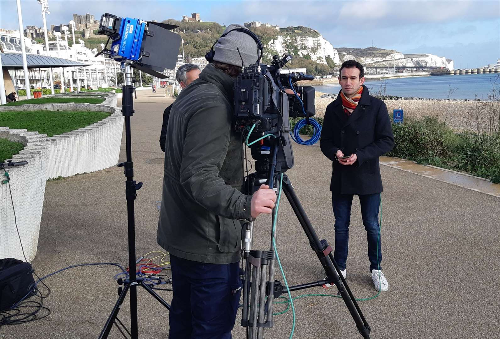 A national TV crew and on the scene reporter at the western end of Dover seafront. Picture: Sam Lennon