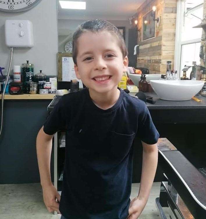 Six year-old Leighton Ovenden had his hair cut at a barbers for the first time in four years. Picture: Amy Ovenden