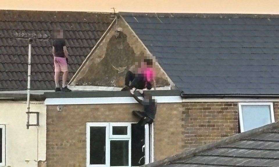 Youngsters climbing roofs at the site in Mill Road. Submitted picture