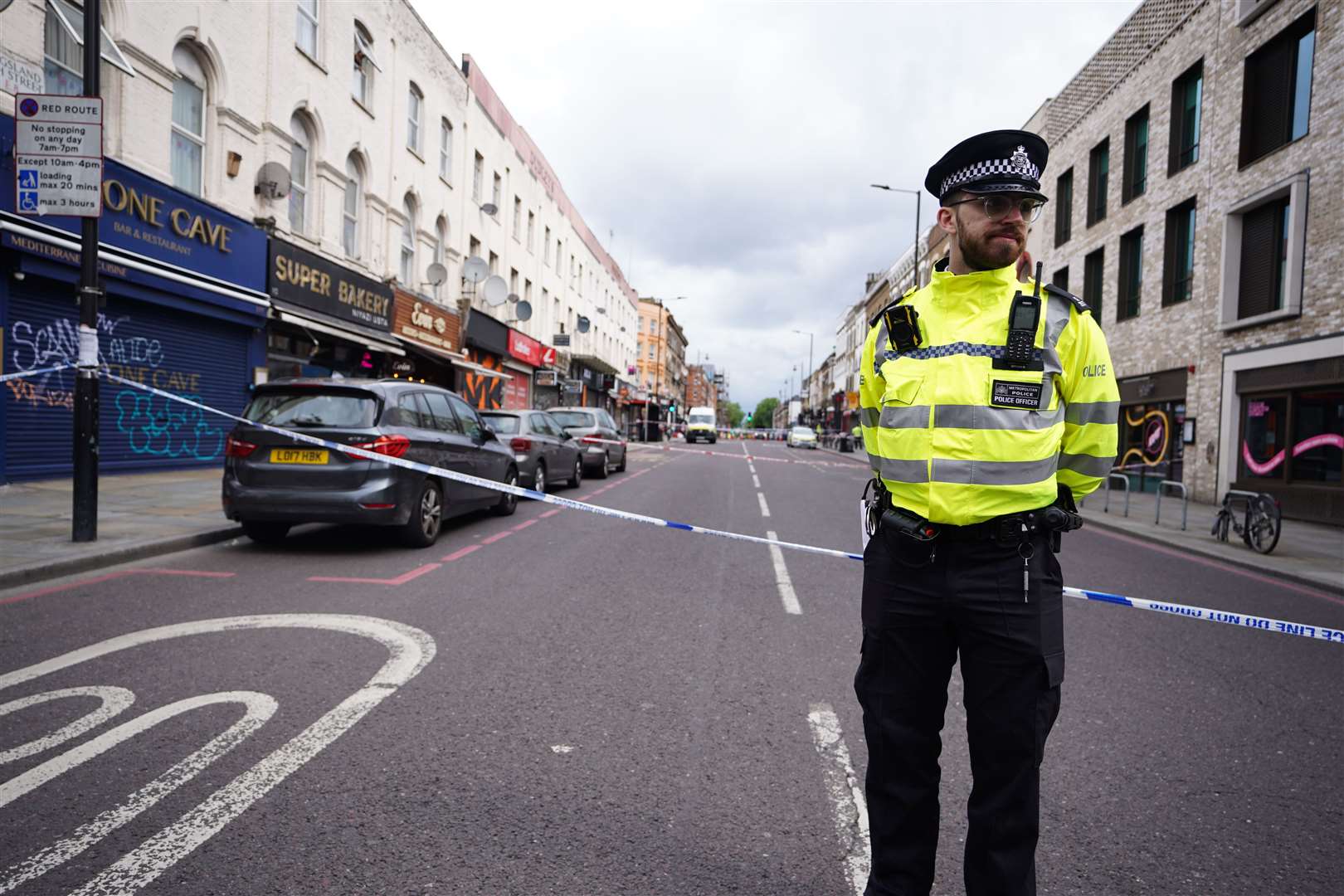 A police officer stands at the scene of the incident (James Manning/PA)