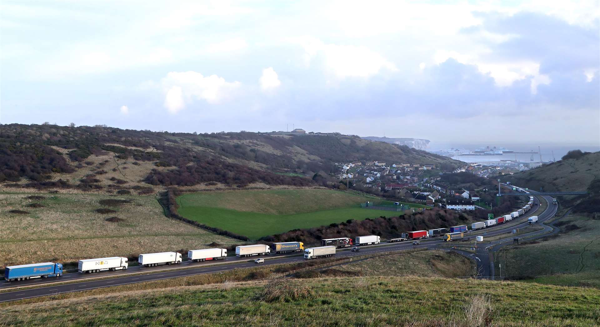 Lorries queue for The Port of Dover along the A20 in Kent (Gareth Fuller/PA)