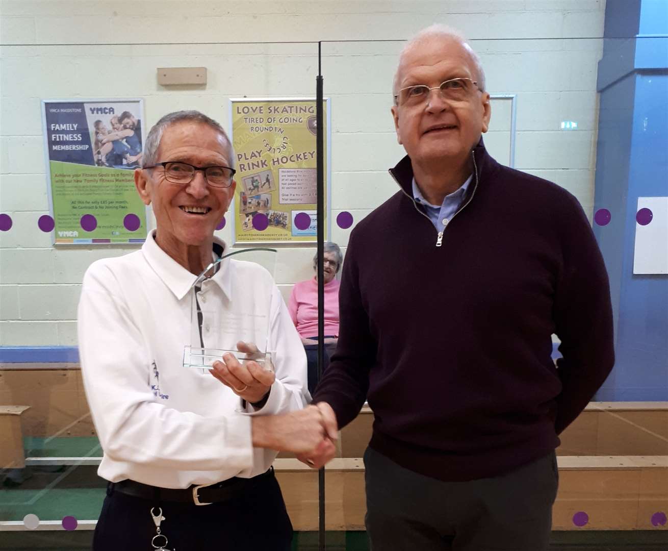 Cyril Davey, left, receives a trophy from Maidstone District Cricket Partnership chairman Paul Budd Picture: Jane Fraser