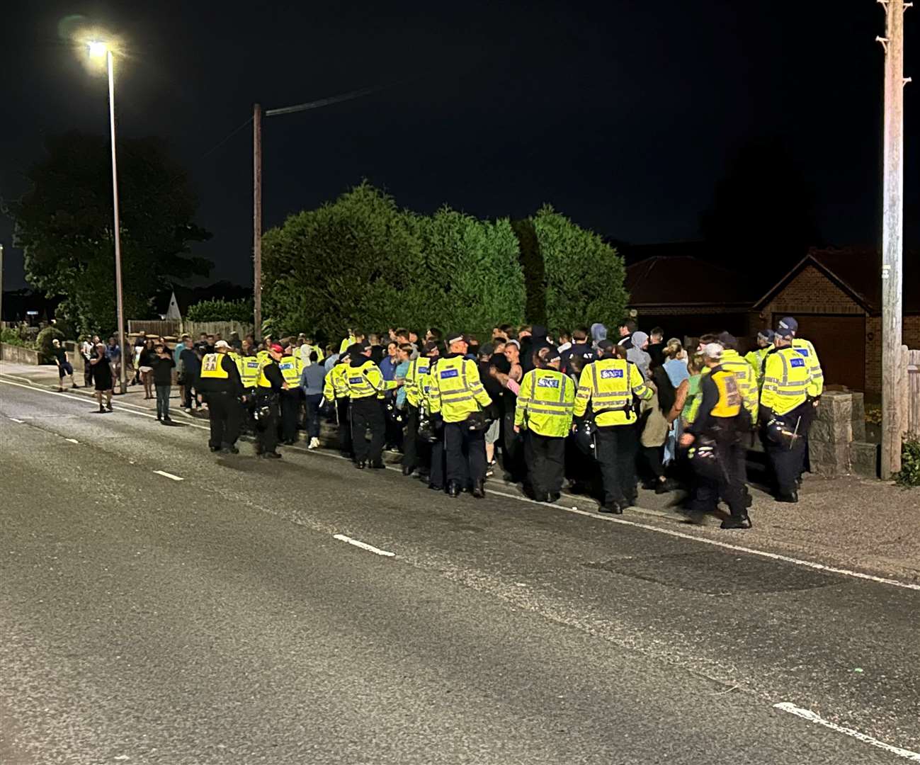 Police officers disperse those who have gathered at a protest outside the Innovation Centre Medway, in Maidstone Road, Chatham, on August 7, 2024