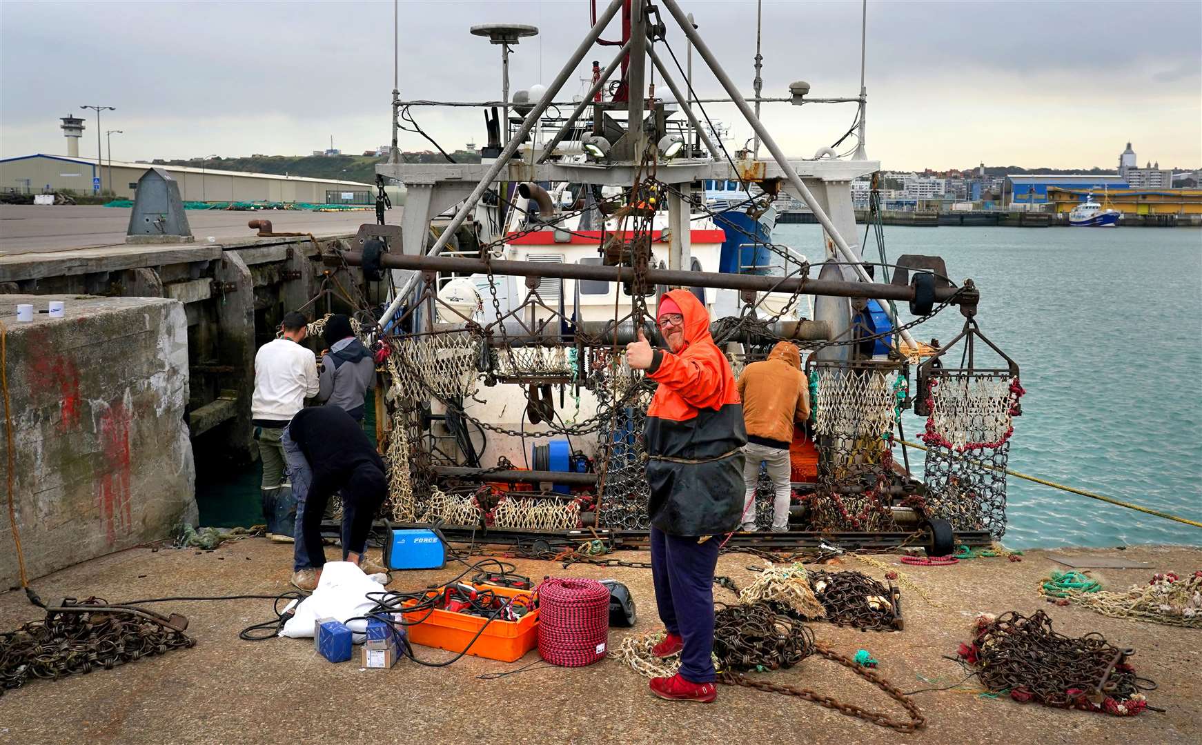 A French fisherman prepares his boat for sea at the port of Boulogne as the cross-Channel fishing row continues (Gareth Fuller/PA)