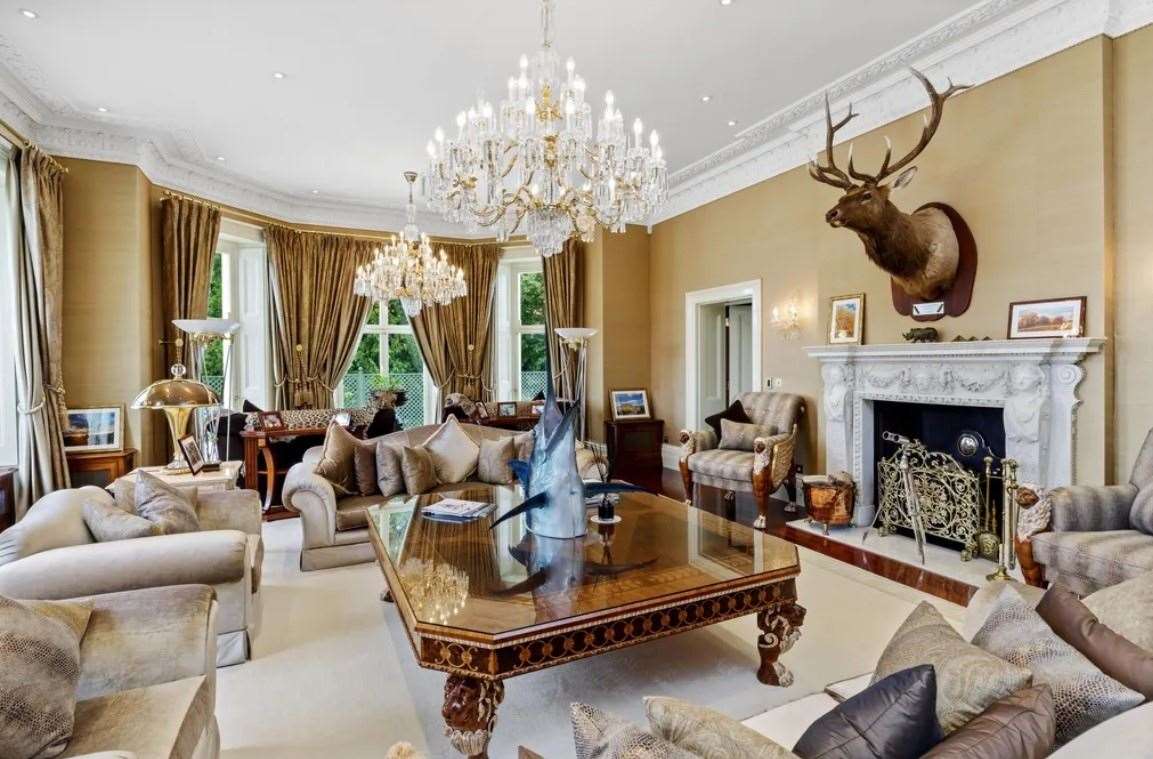 A stag's head and swordfish are among the decorations in this room. Picture: Zoopla / Knight Frank