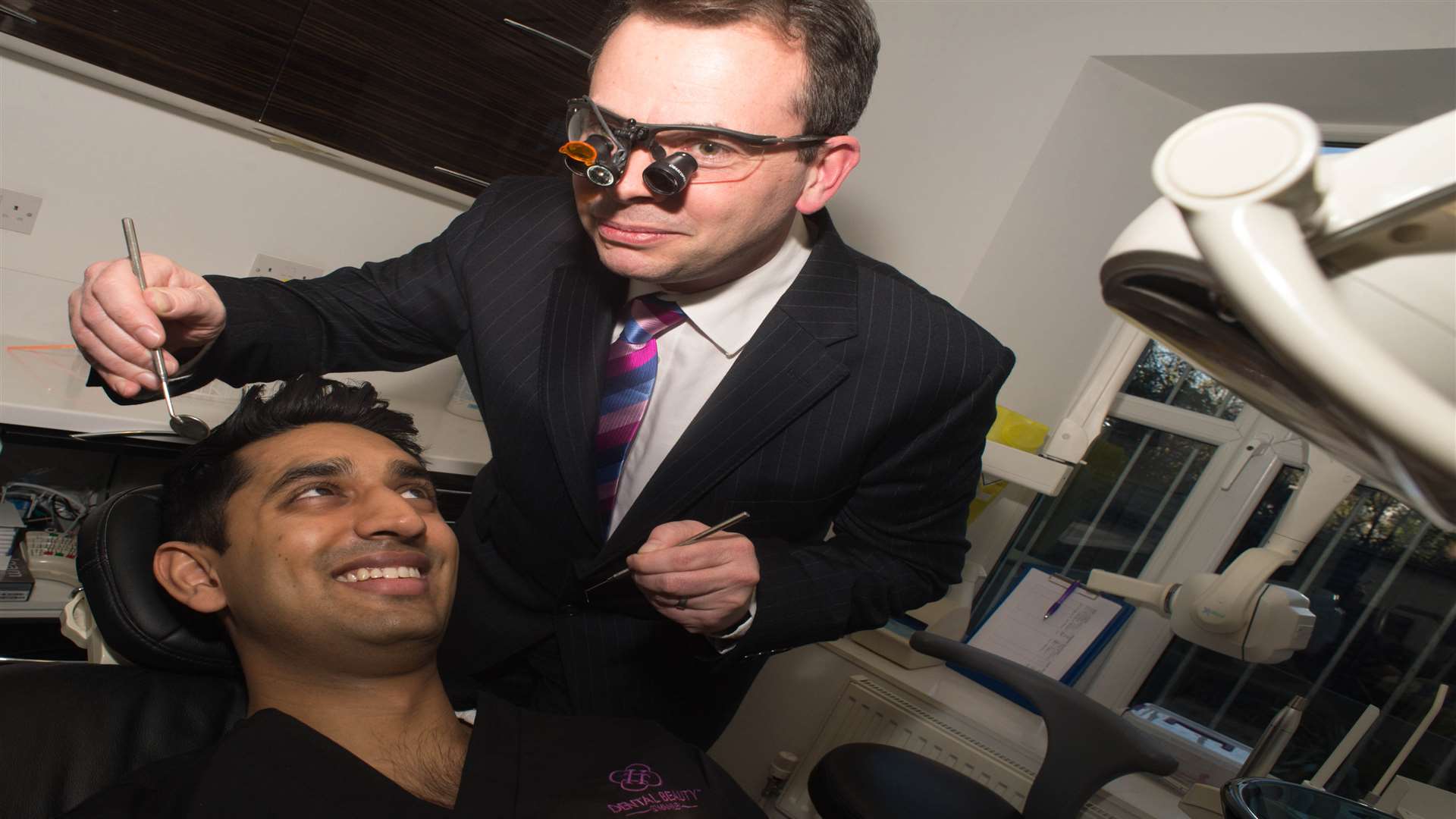 Dental Beauty Swanley owner Dr Dev Patel gets in the chair for a check up with Royal Bank of Scotland senior healthcare manager Paul Barnes