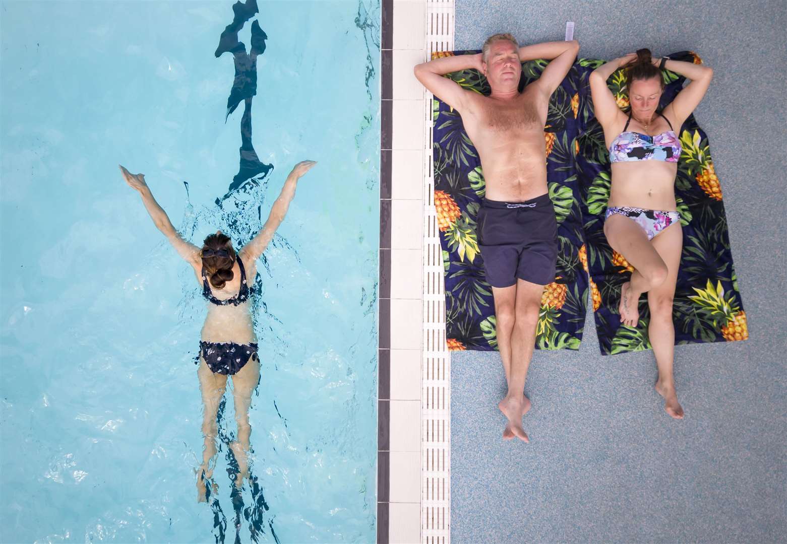 People enjoy the hot weather at Hathersage open air swimming pool at Hope Valley, near Sheffield (Danny Lawson/PA)