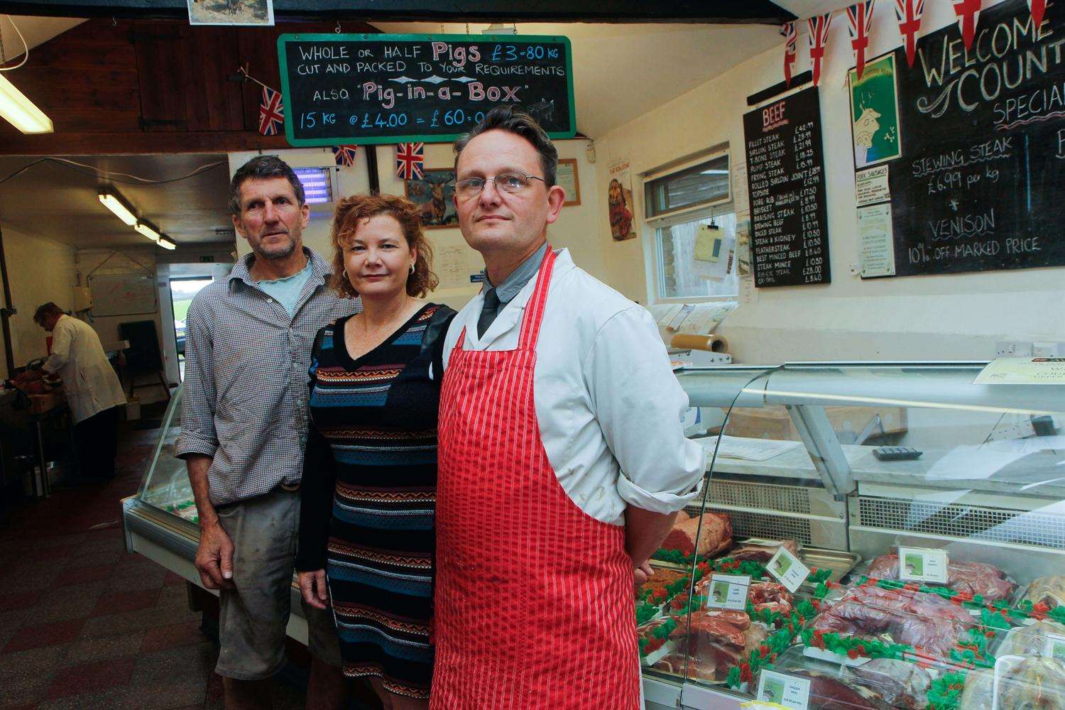 Tania Peitzker-Lingham and Andrew Lingham, left, who are launching an AI robot to serve customers on their farm shop's online e-shop, which will look like one of their butchers Will Reid, right