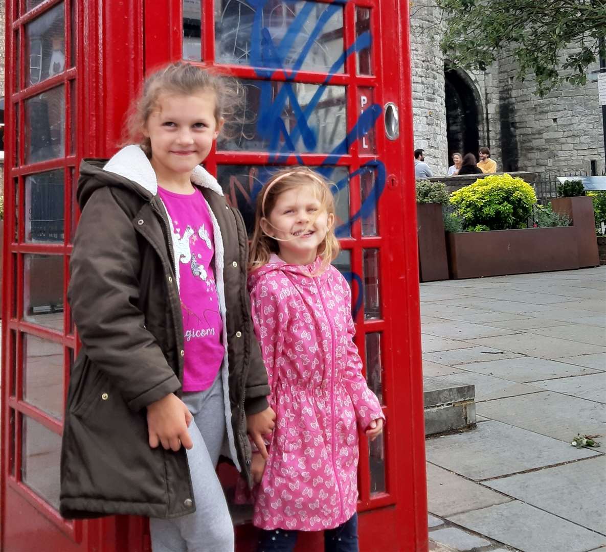 Sophia and Amayah Horton say they are 'sad and upset' at the amount of graffiti blighting Canterbury. Picture: Marc Horton