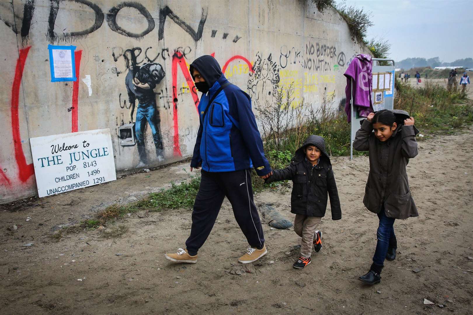 Afghan refugees leave the Calais Jungle to be processed at a registration centre Picture: SWNS