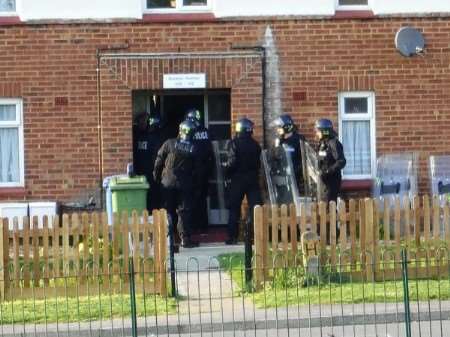 Riot police prepared to enter the flat