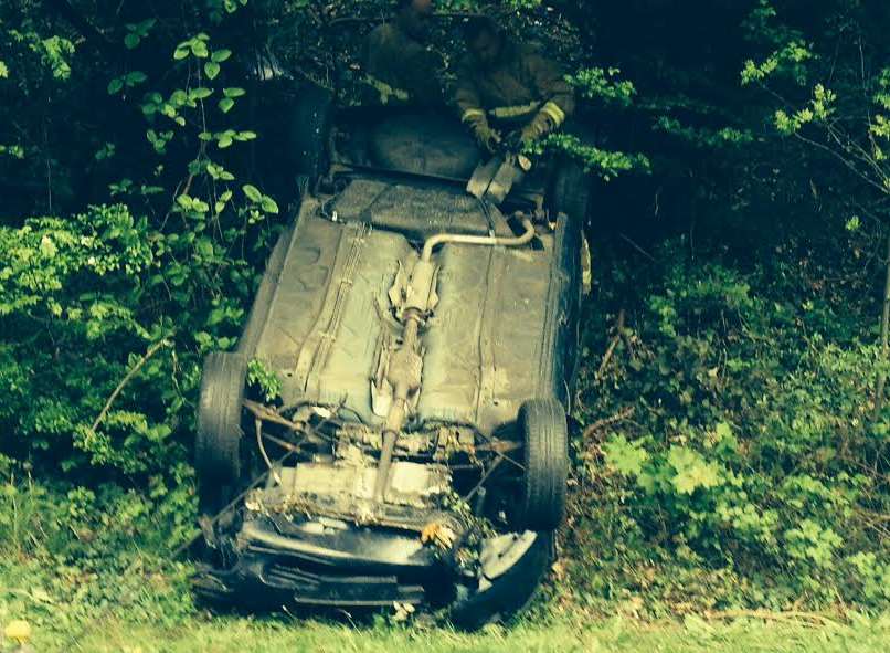 The crash left both cars on their roofs