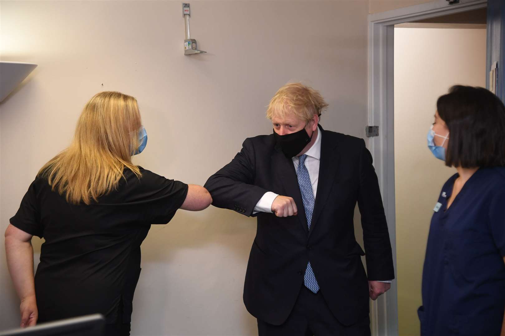 Prime Minister Boris Johnson elbow bumps a member of staff during a visit to Tollgate Medical Centre in Beckton in East London on Friday (Evening Standard/Jeremy Selwyn)