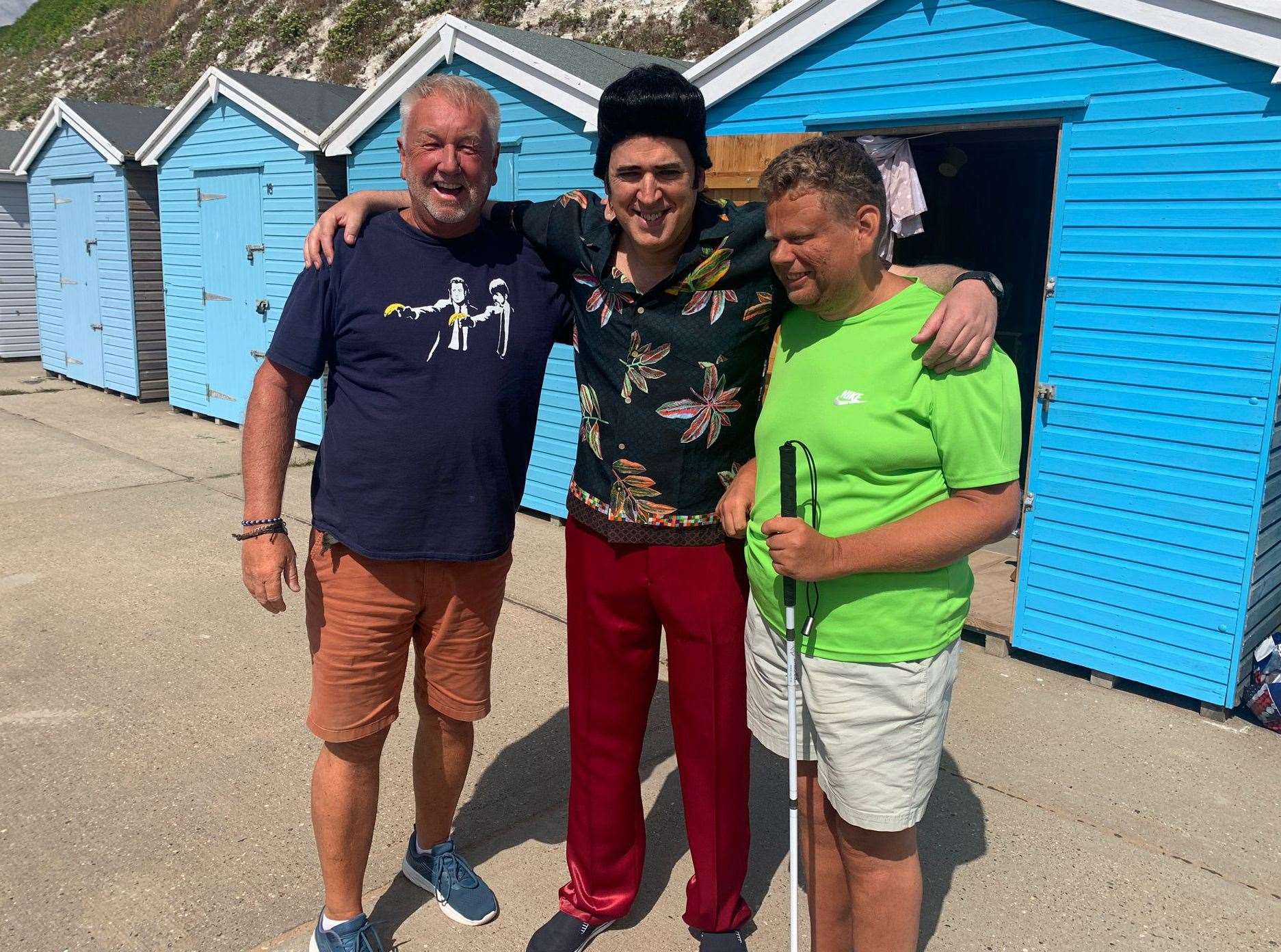 Tim Vine posed for a photo and chatted with Barry Stickings and his son Toby at Dumpton Gap in Broadstairs. Picture: Barry Stickings