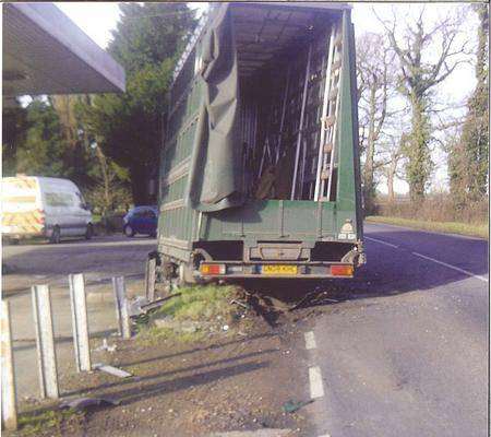 The force of the crash knocked out the Glass Services lorry's brakes and steering, causing it to smash into a garage forecourt