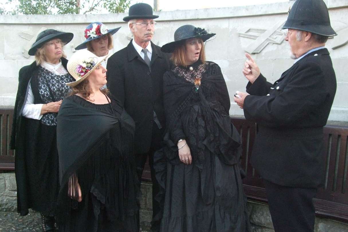 Big Fish Arts actors wearing costumes from the First World War period, which they are inviting people to dress up in for the Promenade Festival