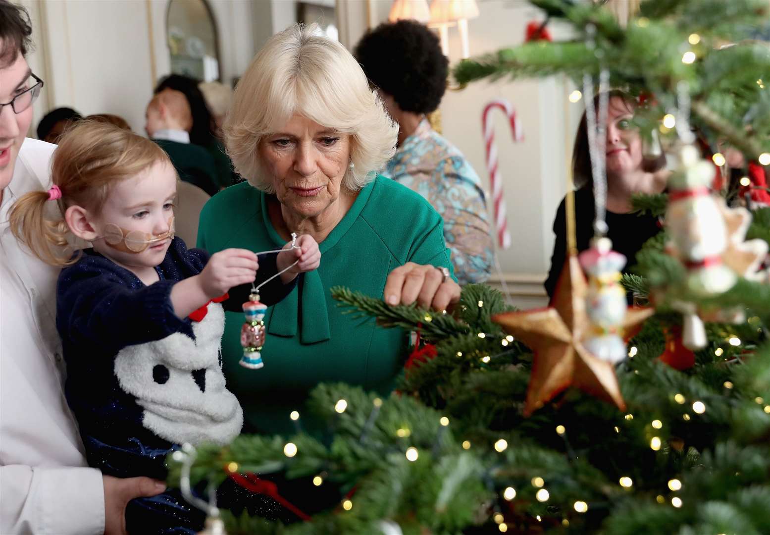 Camilla invites children supported by Helen & Douglas House to decorate the Christmas tree at Clarence House each year (Chris Jackson/PA)