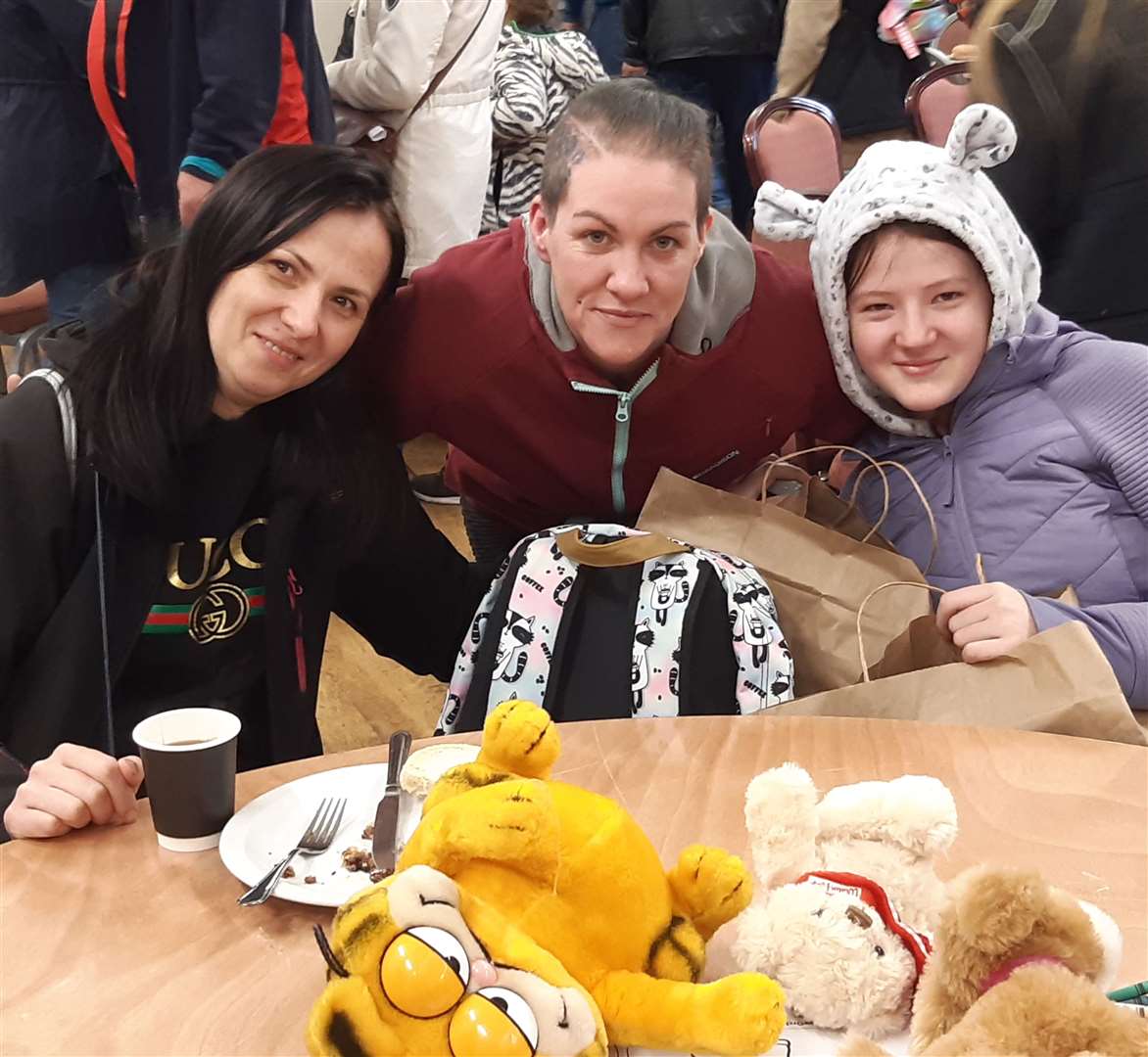 Tracy Marshall, centre, travelled from Edinburgh to pick up Anna, left and her two daughters who she will be hosting. Photo: Sean Delaney