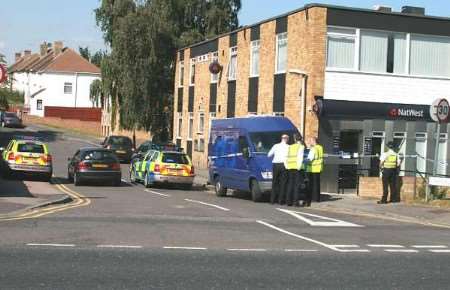 Police officers outside the bank shortly after the robbery occurred. Picture: MIKE MAHONEY