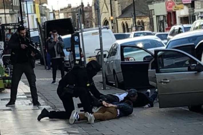 Firearms officers arrested three men. Pic: Alex Vassallo