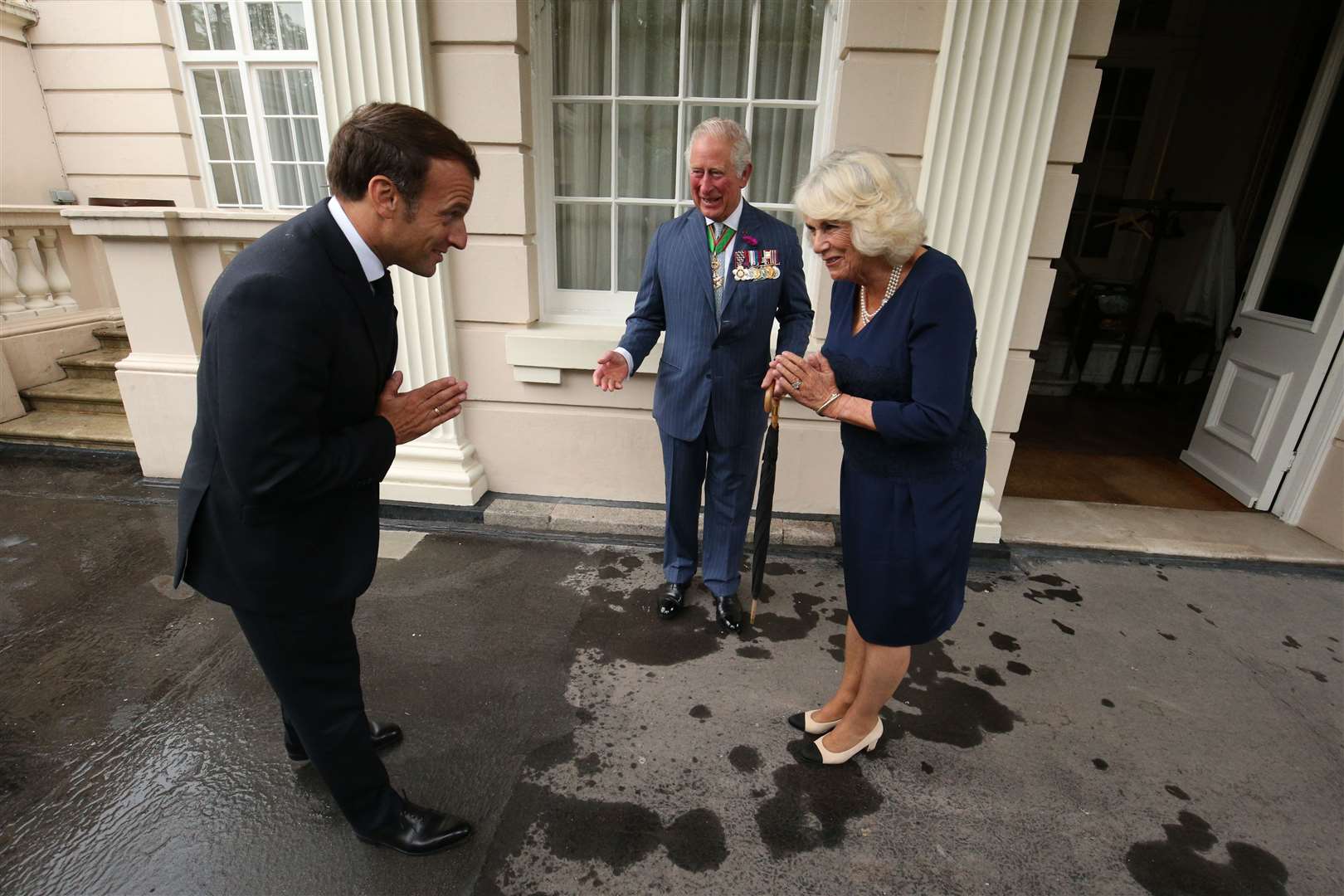 The Prince of Wales and the Duchess of Cornwall greet Emmanuel Macron (Jonathan Brady/PA)