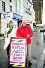 Cllrs Iris Johnston and John Watkins show off the new signs